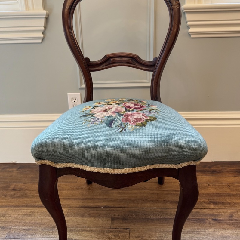 Victorian walnut chair with cabriole legs and floral needlepoint seat.
